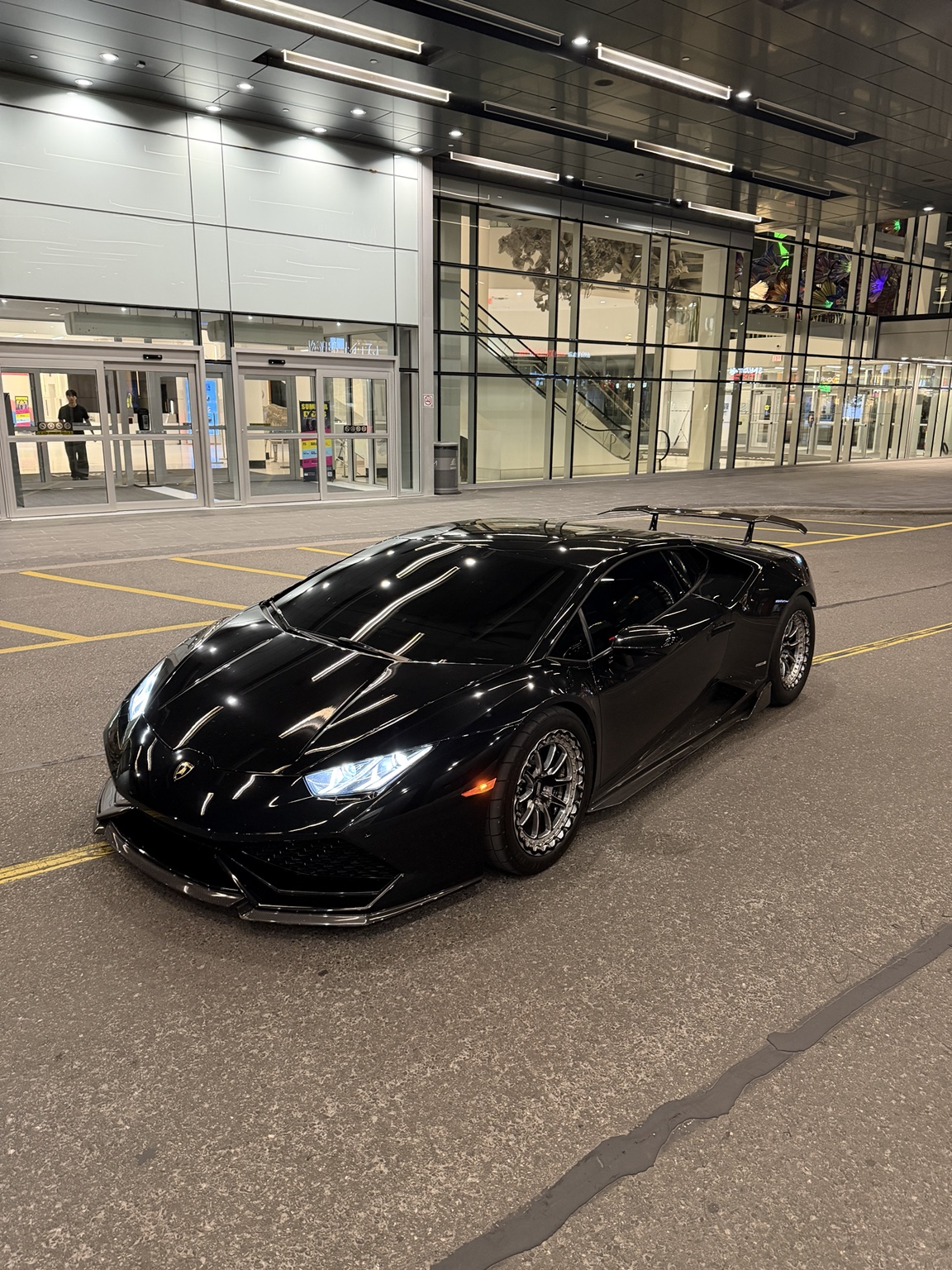 Black Lamborghini photographed at night in Toronto